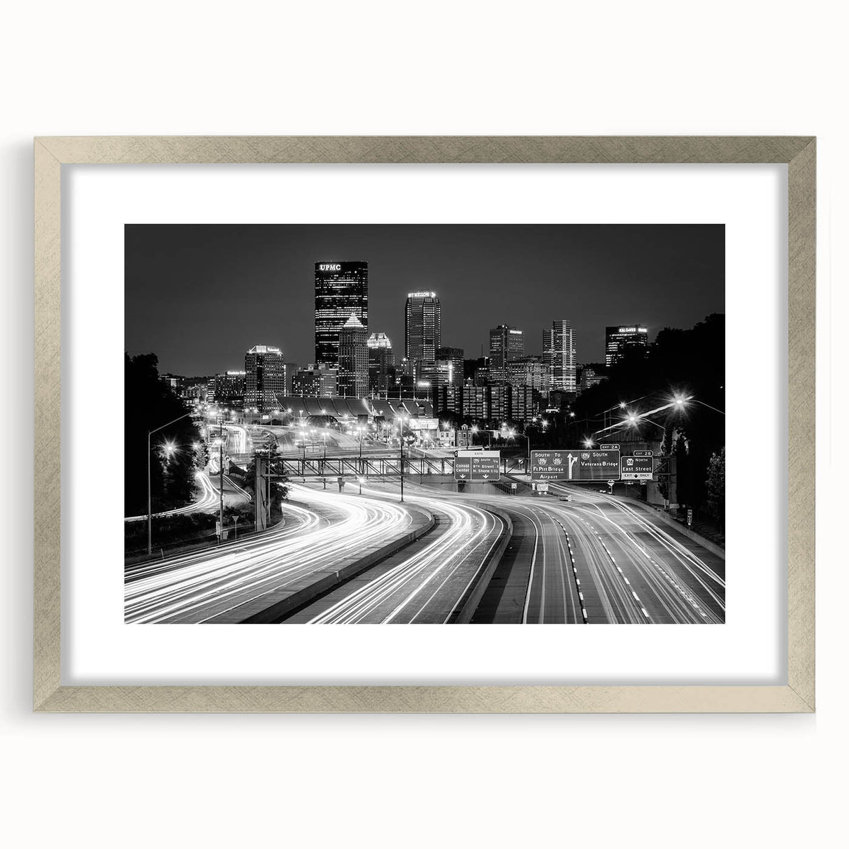 Textured art depicting abstract Pittsburgh skyline in muted gray and blue tones on a framed silver mat.