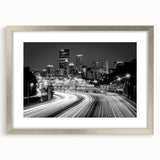 Textured art depicting abstract Pittsburgh skyline in muted gray and blue tones on a framed silver mat.