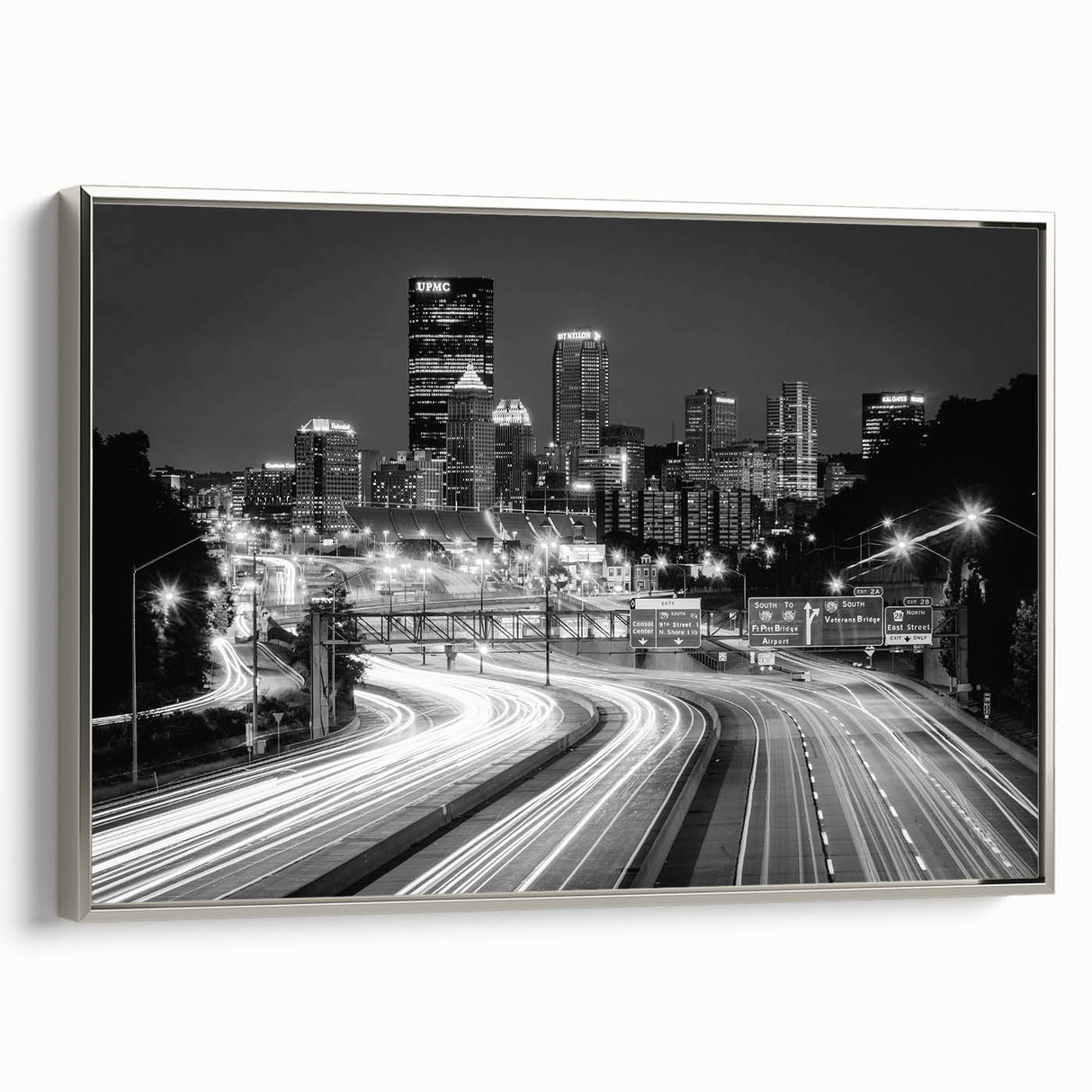 Framed canvas featuring a vintage-style landscape art painting of Pittsburgh, with colorful art in muted tones.