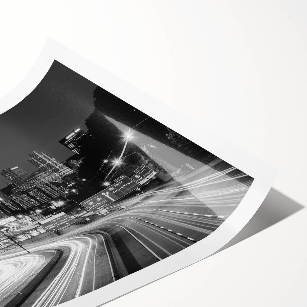 Extra large rolled print of Pittsburgh skyline with line art flowers in muted colors.