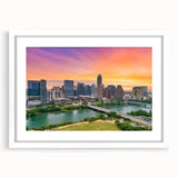 Abstract art print of Austin skyline in muted blue and gray tones on a white framed canvas.