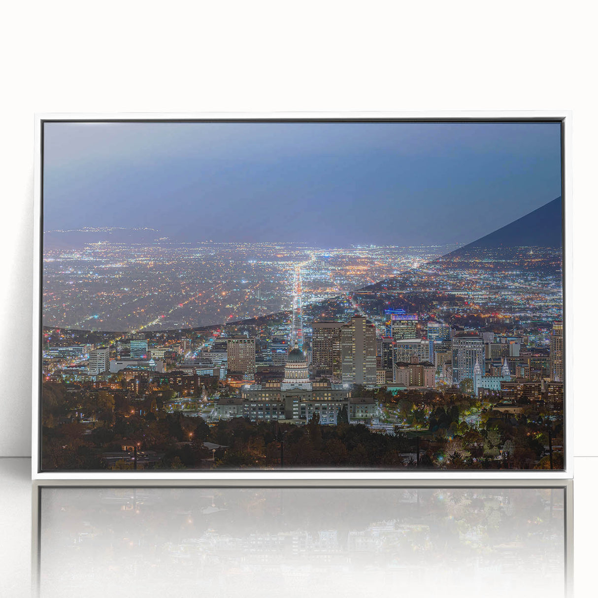 Acrylic print of Salt Lake City with modern art deco design in muted colors, framed in white.