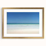 Framed landscape artwork showcasing a serene beach scene, featuring golden matting and a sleek gold frame, perfect for enhancing home decor aesthetics.