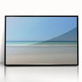 Framed acrylic artwork showcasing a serene beach landscape with calming blue skies and gentle waves, featuring a sleek black frame for a modern touch. Ideal for enhancing coastal-themed decor in any room.