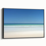 Framed canvas artwork showcasing a stunning beach landscape with vibrant colors, set in a sleek black frame, ideal for enhancing home decor or beach-themed spaces.