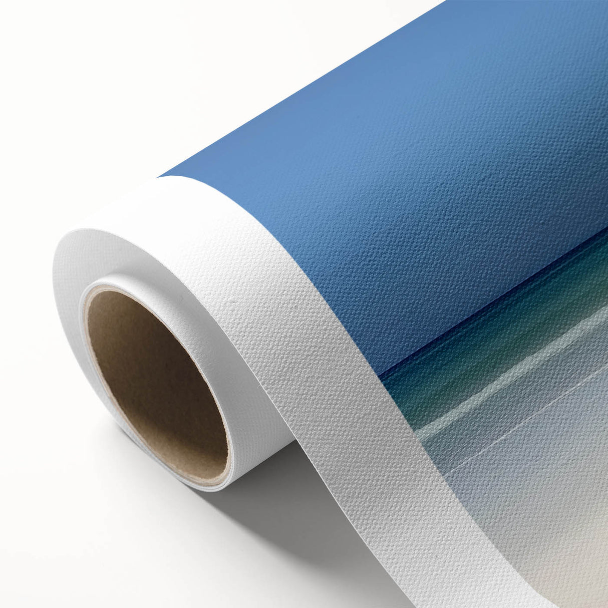 Beautiful rolled canvas artwork depicting a serene beach landscape with gentle waves and a clear blue sky, packaged securely in a protective cardboard tube for safe delivery.