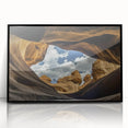 Framed acrylic landscape artwork showcasing vibrant canyons in warm hues, featuring a sleek black frame, perfect for modern home decor and art enthusiasts.
