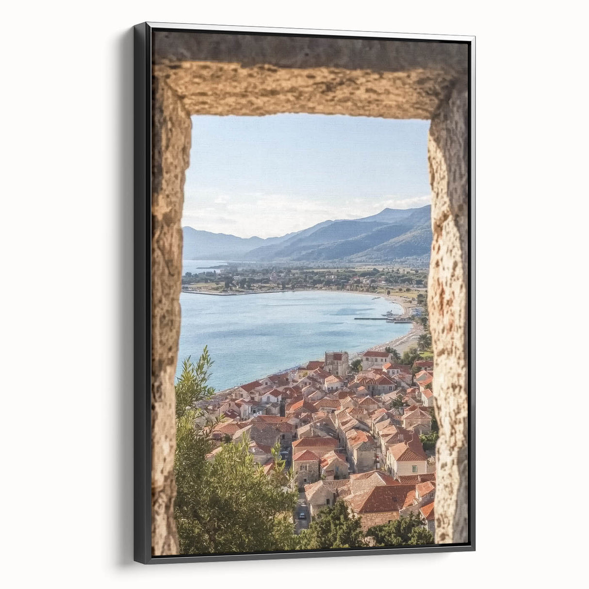 Framed canvas artwork showcasing a scenic landscape with a majestic castle against a vibrant sky, featuring a sleek black frame and side view for dimension.