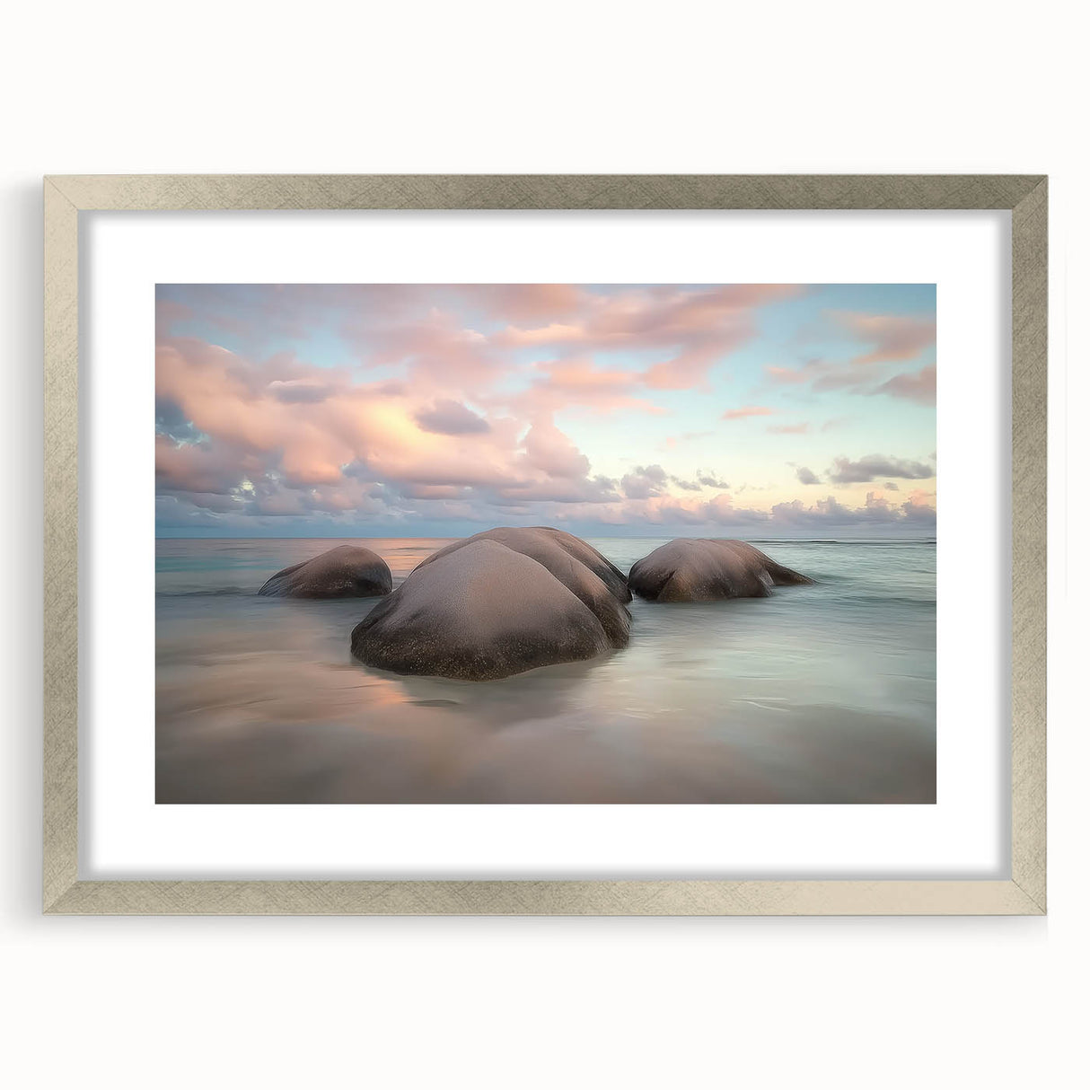 Framed landscape artwork showcasing serene beach scenery with vibrant colors, featuring a silver mat and frame, ideal for coastal-themed home decor.