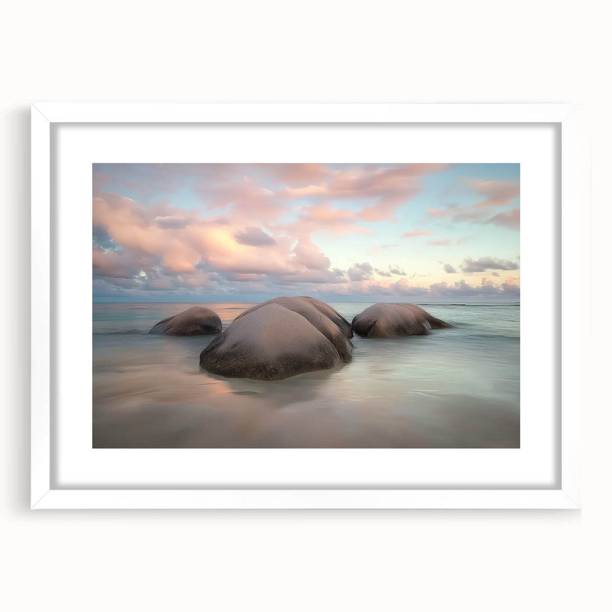 Elegant landscape artwork depicting serene beaches, framed in a white mat, showcasing soft pastel colors that evoke tranquility and relaxation, perfect for home decor.
