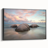 Framed canvas artwork depicting a serene beach landscape with vibrant colors and calming waves, showcasing a sleek black frame from a side view, perfect for home decor.