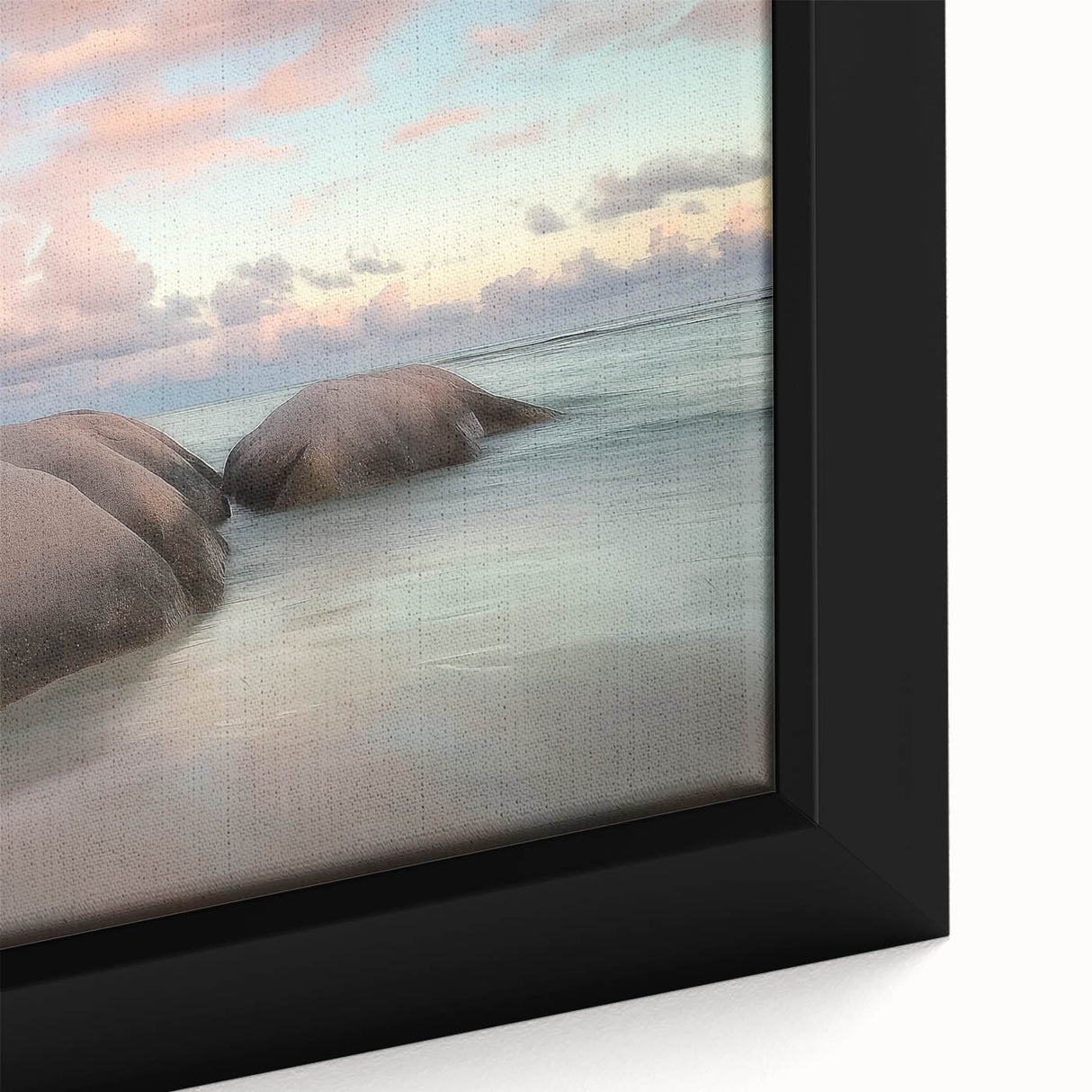 Close-up of a framed landscape canvas depicting serene beaches at sunset, showcasing vibrant colors and intricate details, perfect for coastal decor enthusiasts.