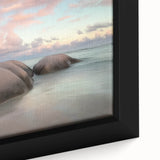 Close-up of a framed landscape canvas depicting serene beaches at sunset, showcasing vibrant colors and intricate details, perfect for coastal decor enthusiasts.