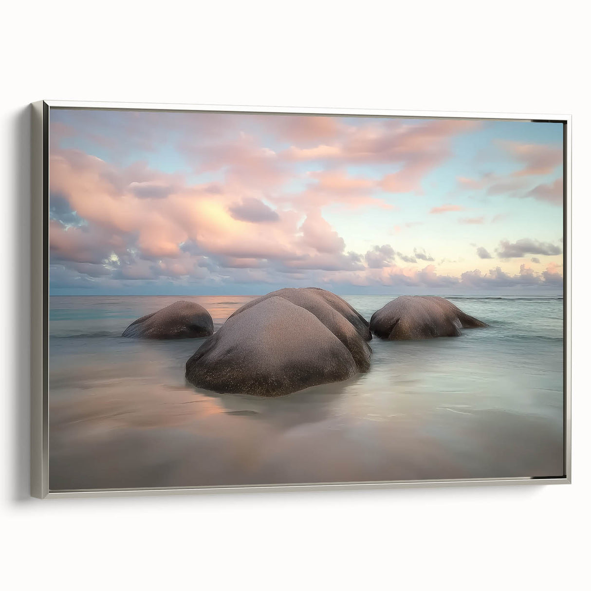 Framed canvas artwork depicting a serene beach landscape with vibrant colors and silver frame, ideal for enhancing coastal-themed home decor.