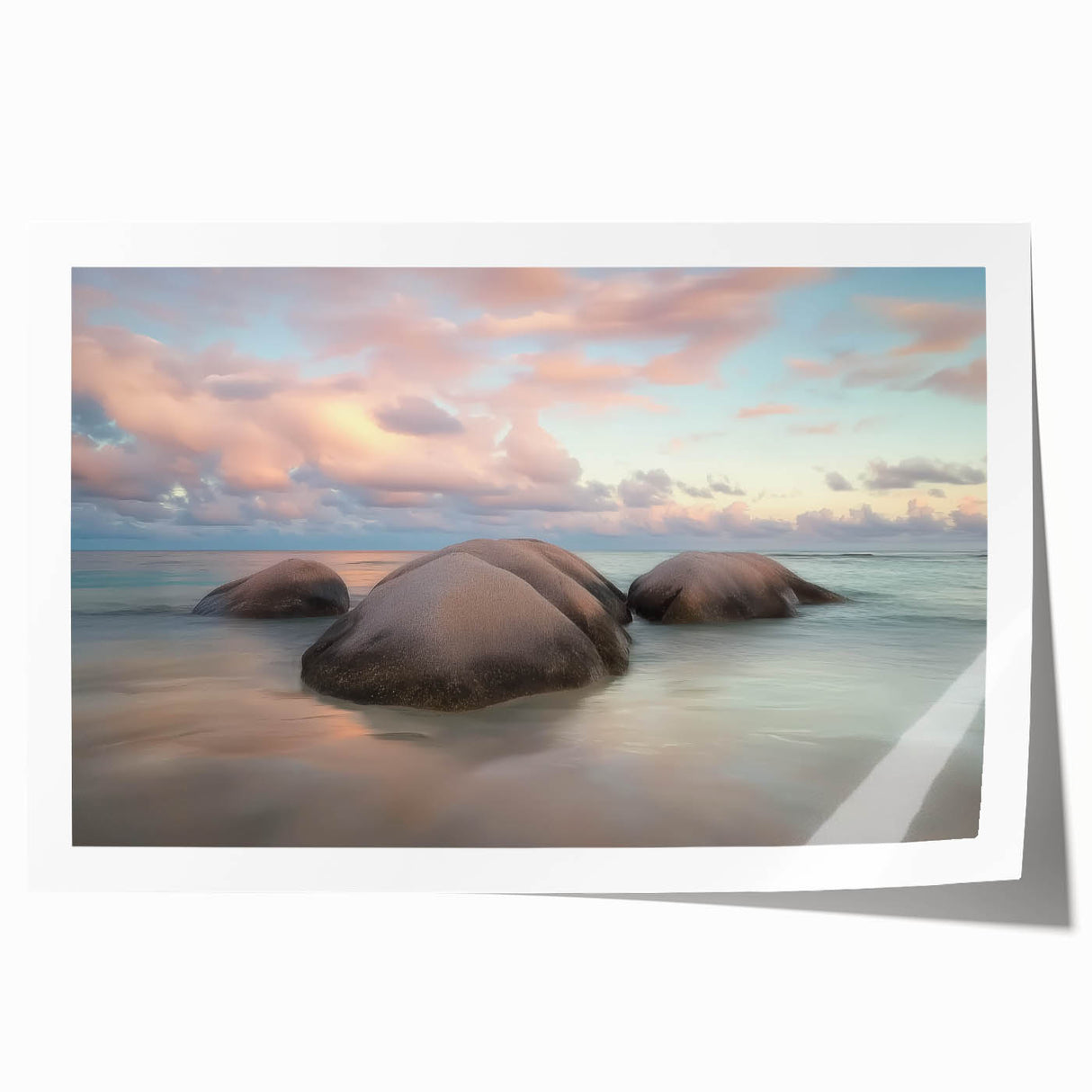 Vibrant rolled print showcasing a serene beach landscape with soft waves and a clear blue sky, packaged securely in a protective cardboard tube for safe delivery.