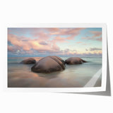 Vibrant rolled print showcasing a serene beach landscape with soft waves and a clear blue sky, packaged securely in a protective cardboard tube for safe delivery.