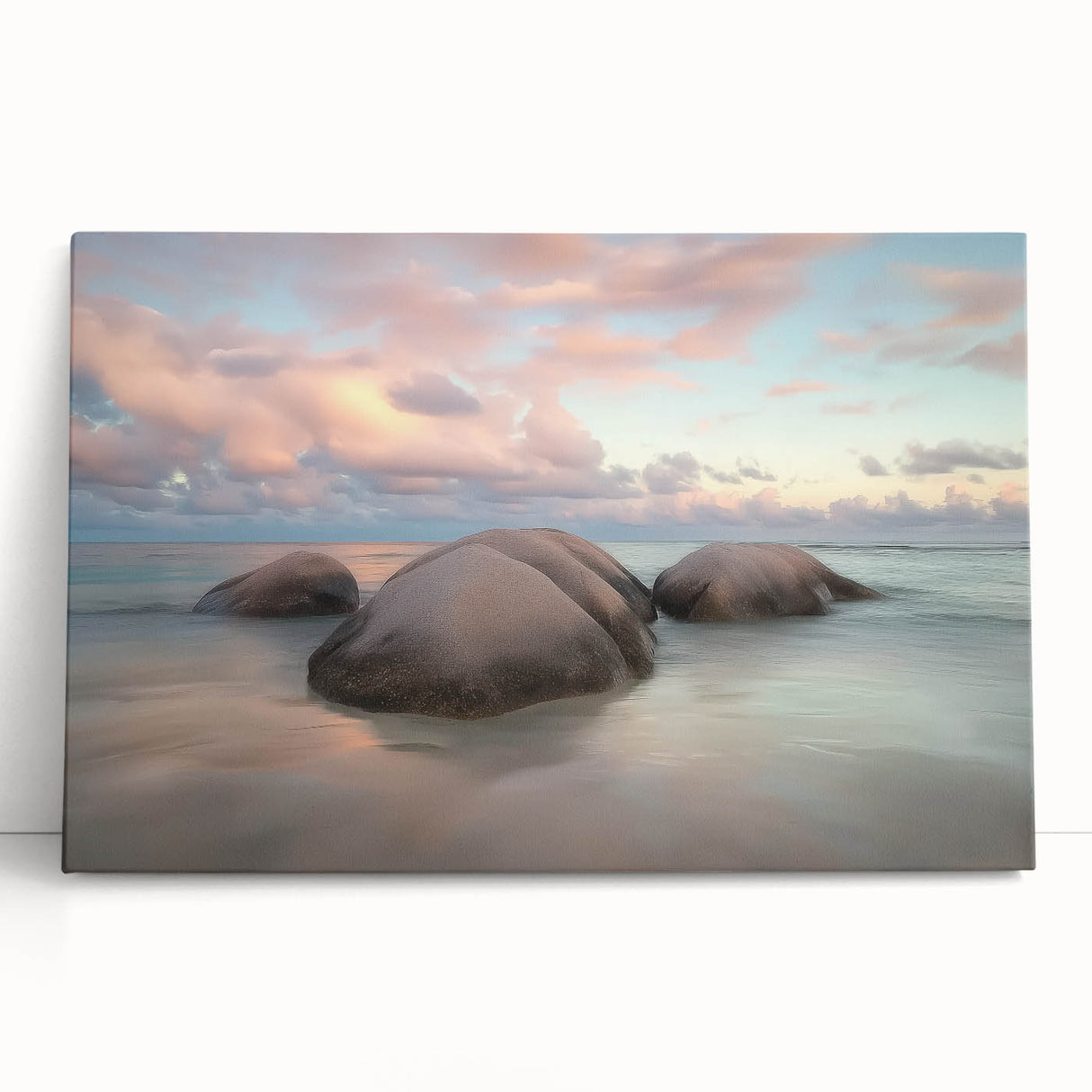 Stretched canvas artwork depicting a serene beach landscape with soft waves and a vibrant sunset, perfect for elevating coastal home decor aesthetics.