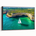 Framed canvas artwork showcasing a dramatic cliff landscape with rich colors, presented in a sleek black frame, ideal for enhancing modern home decor.