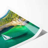 Stunning landscape print showcasing dramatic cliffs and a vibrant sky, rolled and securely packaged in a protective cardboard tube for easy transport and display.
