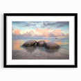Black-framed landscape wall art depicting serene beaches with a mat, showcasing vibrant colors and intricate details, ideal for home decor enhancement.