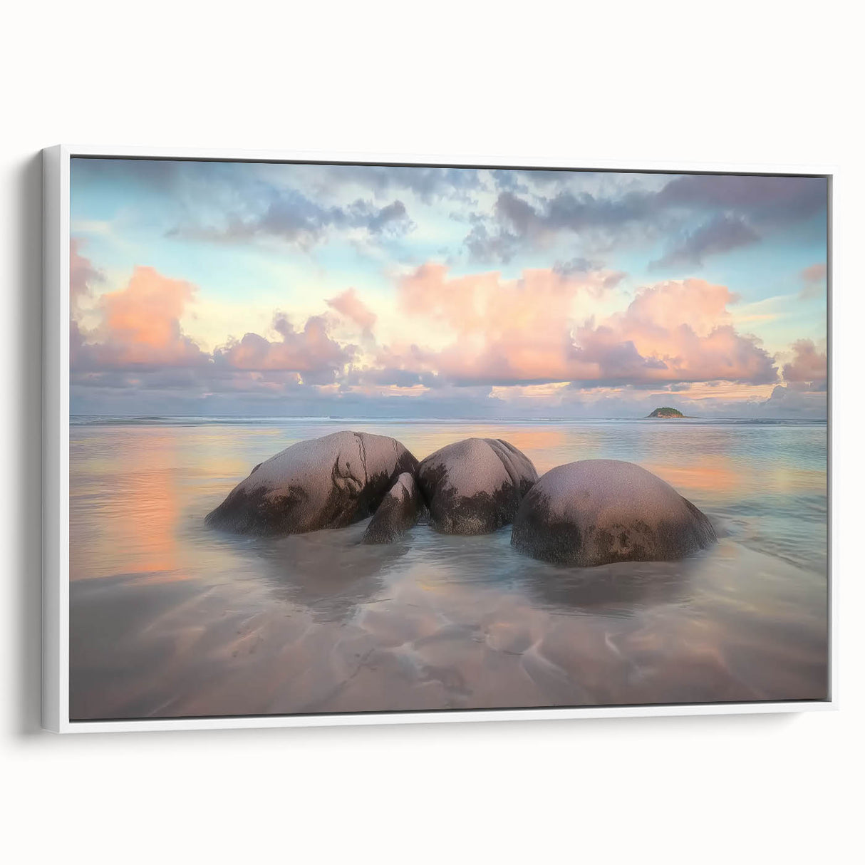 Framed canvas artwork depicting a serene beach landscape with soft waves and a clear sky, presented in a white frame, ideal for coastal-themed decor.
