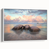 Framed canvas artwork depicting a serene beach landscape with soft waves and a clear sky, presented in a white frame, ideal for coastal-themed decor.