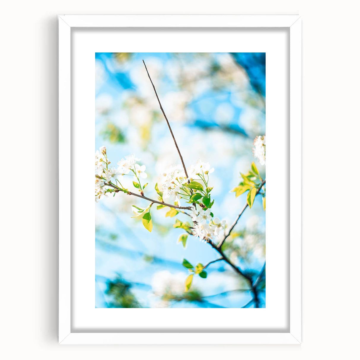 Abstract art print featuring swirling spring hues on a white framed canvas, ideal for dining room or bedroom decor.