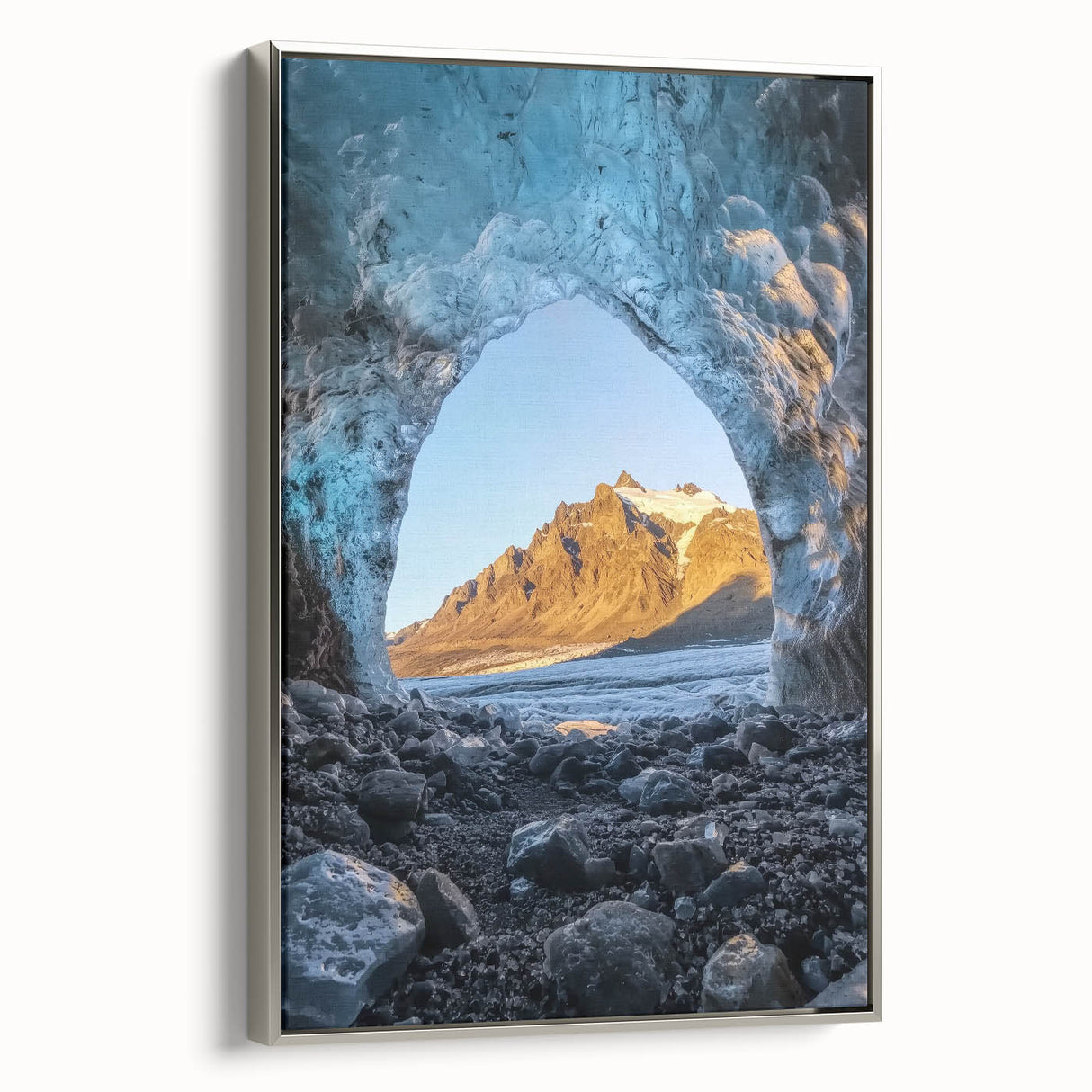 Framed canvas artwork showcasing a serene landscape with caves, featuring a silver frame that enhances the visual appeal. Ideal for modern home decor.