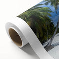Vibrant rolled canvas artwork depicting a serene beach landscape, showcasing gentle waves and golden sands, ideal for coastal home decor or beach-themed interiors. The piece is packaged securely in a protective cardboard tube, ensuring safe delivery.
