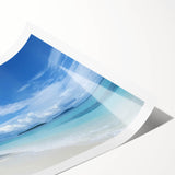 Stunning rolled canvas print showcasing a tranquil beach landscape, featuring soft waves and sandy shores, rolled for easy transport in a protective tube.