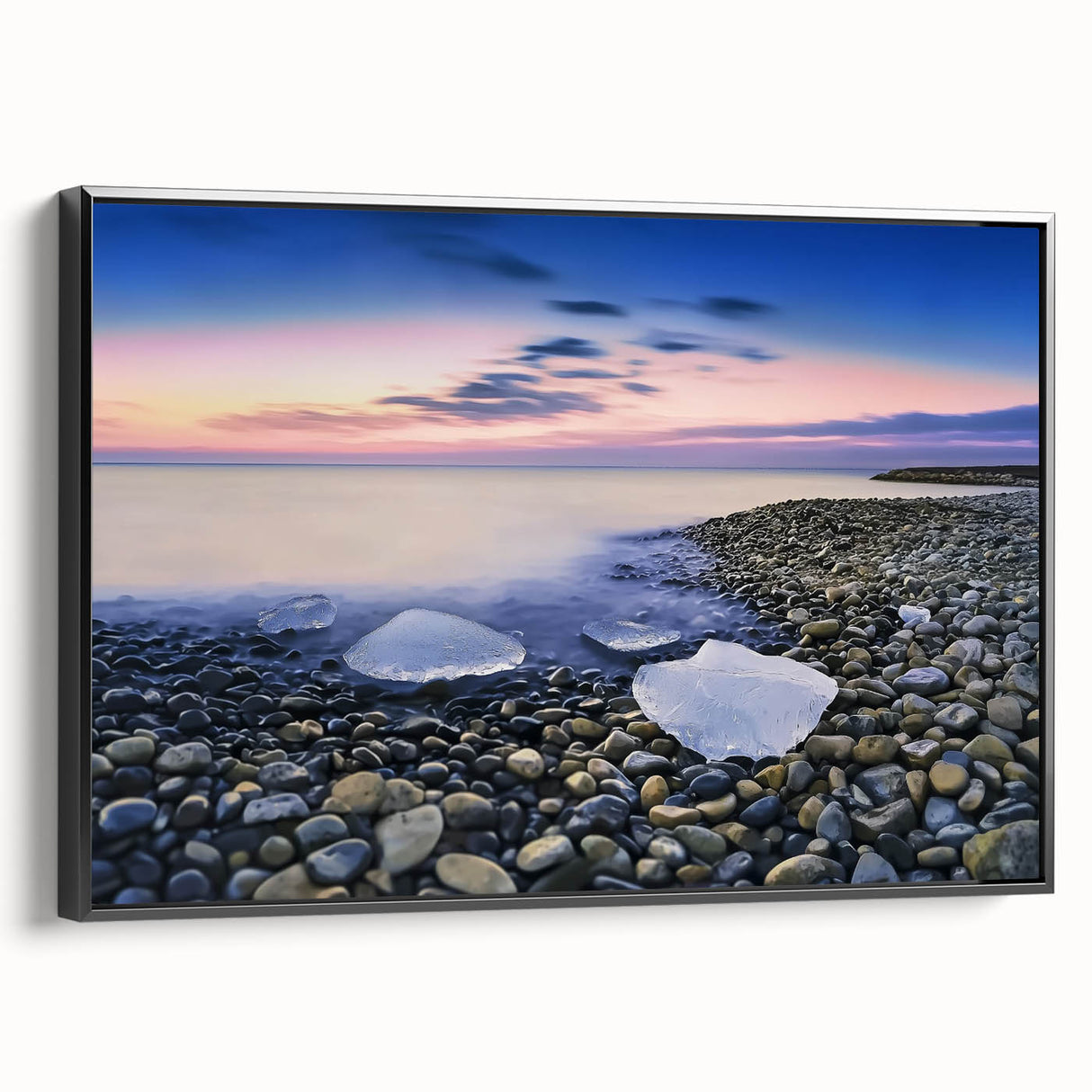 Framed canvas artwork depicting a serene beach landscape in vibrant colors, showcasing gentle waves and palm trees, presented in a sleek black frame for modern decor.
