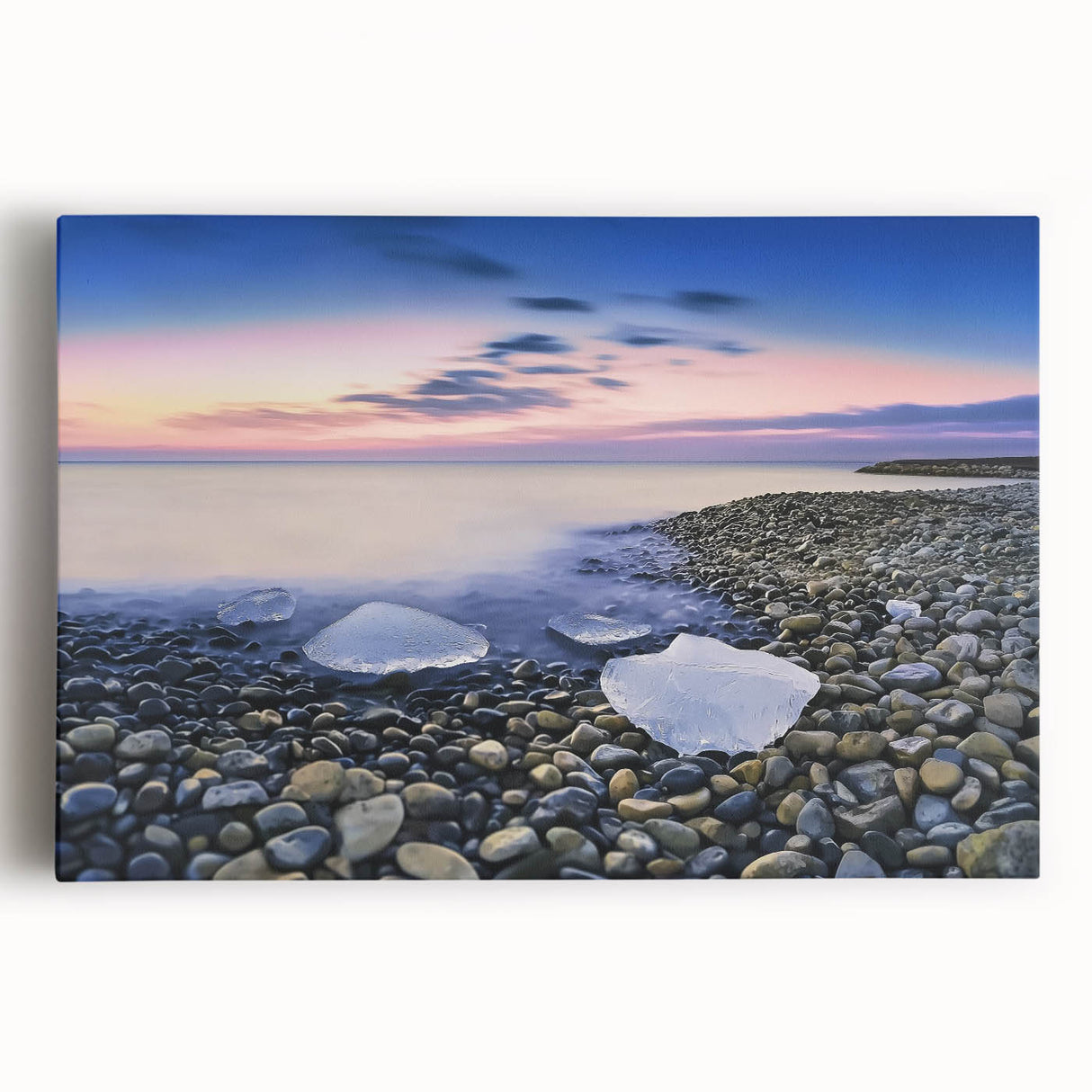 Stretched canvas artwork depicting a serene beach landscape with soft waves and a vibrant sunset, perfect for coastal home decor and relaxation themes.