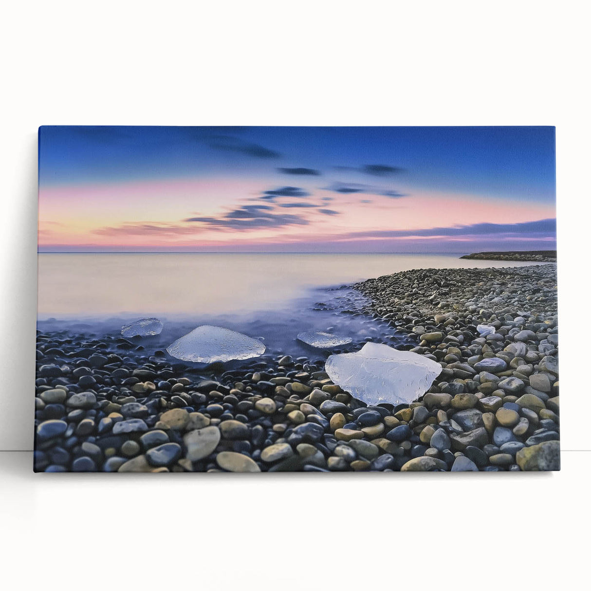 Stretched canvas artwork depicting a serene beach landscape with soft waves and vibrant sunset colors, ideal for coastal home decor and relaxation themes.