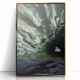 Framed acrylic artwork showcasing a stunning landscape with caves, highlighted by a gold front, perfect for modern home decor and interior design enhancement.