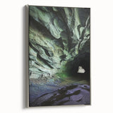 Framed canvas artwork depicting a stunning landscape with intricate cave formations, featuring a silver frame that enhances the visual appeal, perfect for modern home decor.