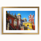 Golden-framed landscape artwork depicting a majestic castle scene, elegantly matted for a polished presentation, ideal for home decor or gallery display.