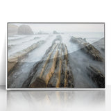 Framed acrylic artwork depicting a serene beach landscape with vibrant colors and gentle waves, elegantly mounted in a white frame for a calming decor touch.