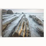 Stretched canvas artwork depicting a serene beach landscape with vibrant colors, showcasing gentle waves and a clear sky, ideal for coastal-themed home decor.