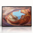 Framed acrylic artwork depicting a stunning landscape of canyons in vibrant colors, set against a sleek black frame, ideal for modern home decor.