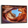 Framed canvas art depicting a stunning landscape of canyons, featuring rich earthy tones and intricate details, presented in a sleek black frame, perfect for home decor.