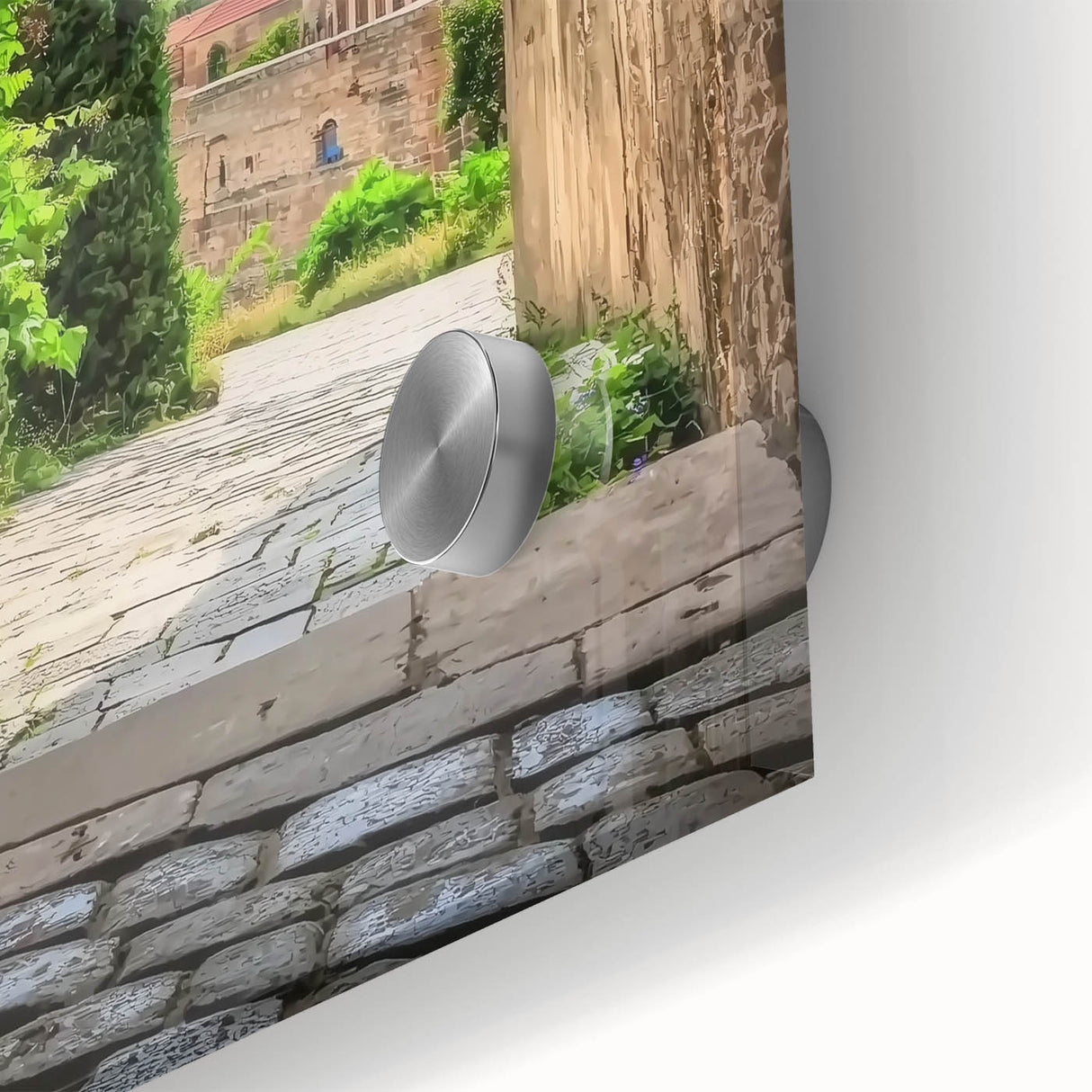 Close-up of an acrylic glass artwork showcasing a vibrant landscape with a majestic castle surrounded by lush greenery, enhancing any interior decor.