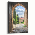Framed canvas artwork depicting a serene landscape with a majestic castle, featuring a black frame and side view, ideal for enhancing home decor.