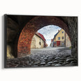 Framed canvas artwork showcasing a stunning landscape with a majestic castle set against a vibrant sky, presented in a sleek black frame, ideal for home decor.