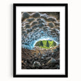 Framed black landscape artwork featuring intricate cave designs, presented in a sleek black frame with a mat, perfect for modern home decor and gallery displays.