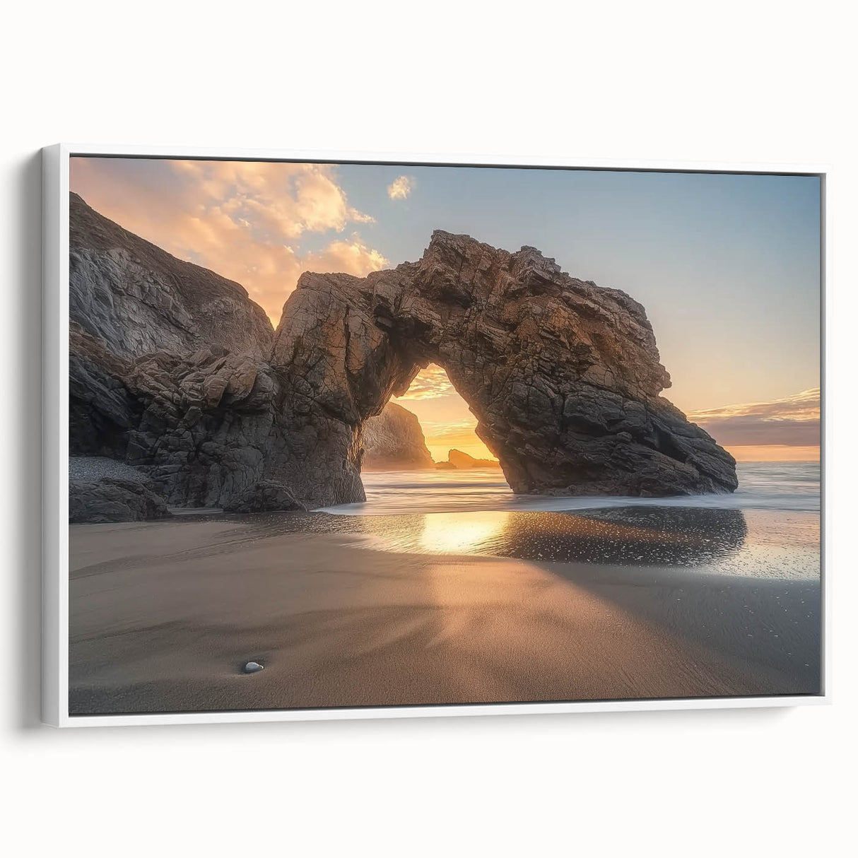 Framed landscape canvas showcasing a serene beach scene with gentle waves and soft sand, featuring a crisp white frame that enhances the coastal aesthetic. Perfect for home decor, this artwork adds a tranquil touch to any room.