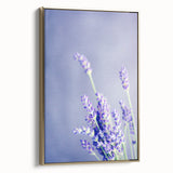 Framed canvas depicting a vintage spring landscape with lush greenery and soft blue skies, ideal for bedroom wall art.