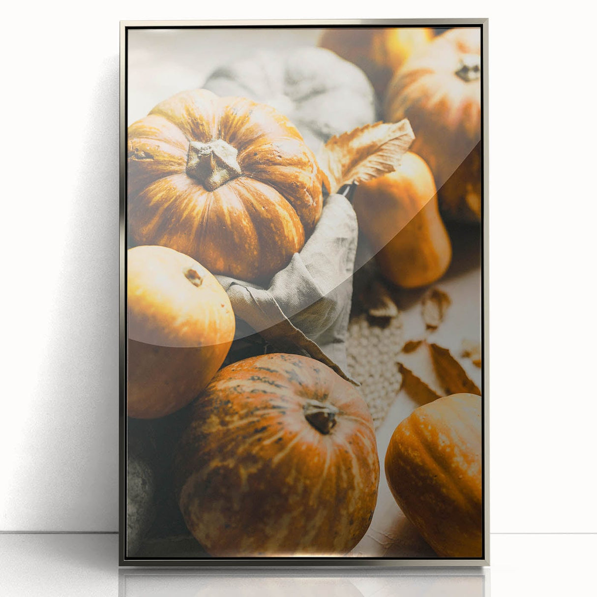 Mid-century modernist art depicting an abstract fall scene in warm orange and brown tones, framed in silver acrylic.