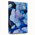 Large abstract wall art depicting spring season in vibrant green and pink tones on acrylic glass.