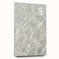 Large abstract wall art on acrylic glass featuring swirls of blue and white, ideal for modern bedroom or dining room decor.