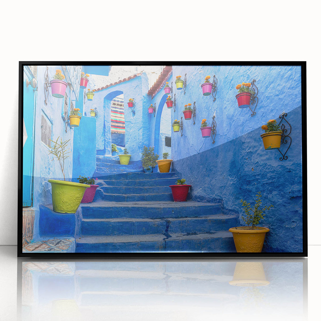 Large abstract wall art depicting a Moroccan landscape in muted earth tones, framed in black acrylic.